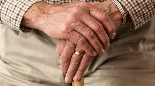 Hands of an older adult man